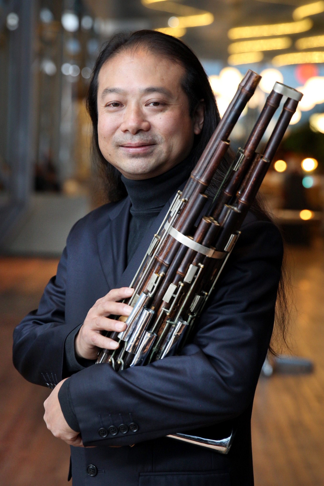 Wu Wei holding a sheng